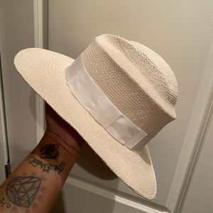 Gladys Tamez white straw hat
